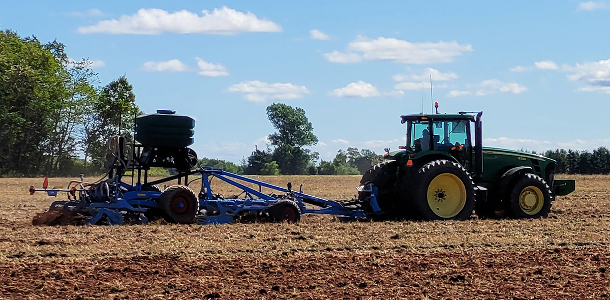 A farmer in western Prince Edward Island performing vertical tillage and seeding a cover crop at the same time. Photo courtesy of the Prince Edward Island Potato Board.