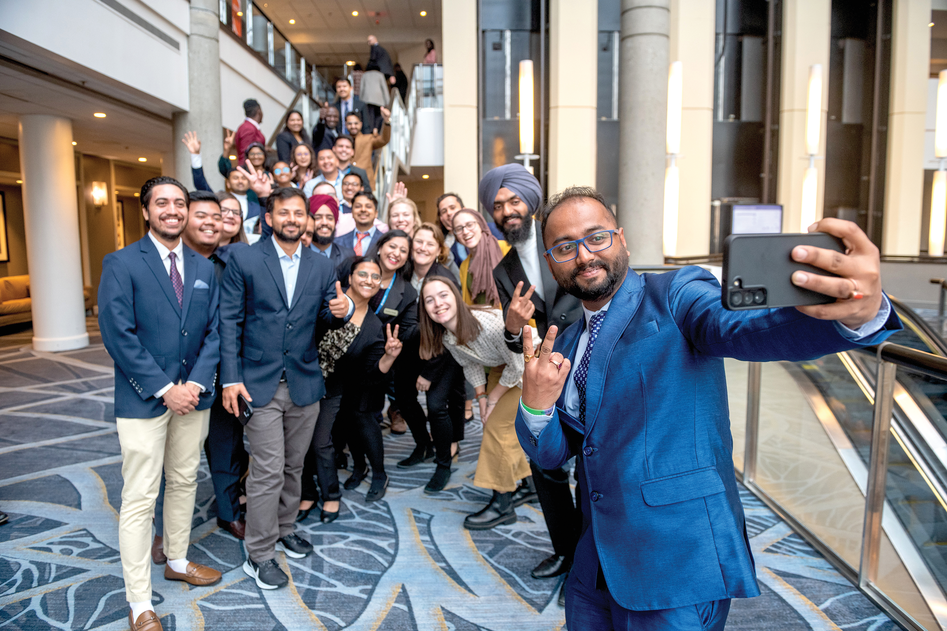 Graduate students pose for a picture at the 2022 ASA, CSSA, and SSSA Annual Meeting. Taking the picture in the foreground is 2022 travel scholarship recipient Jyoti Prasad Kakati. Photo by Remsberg.