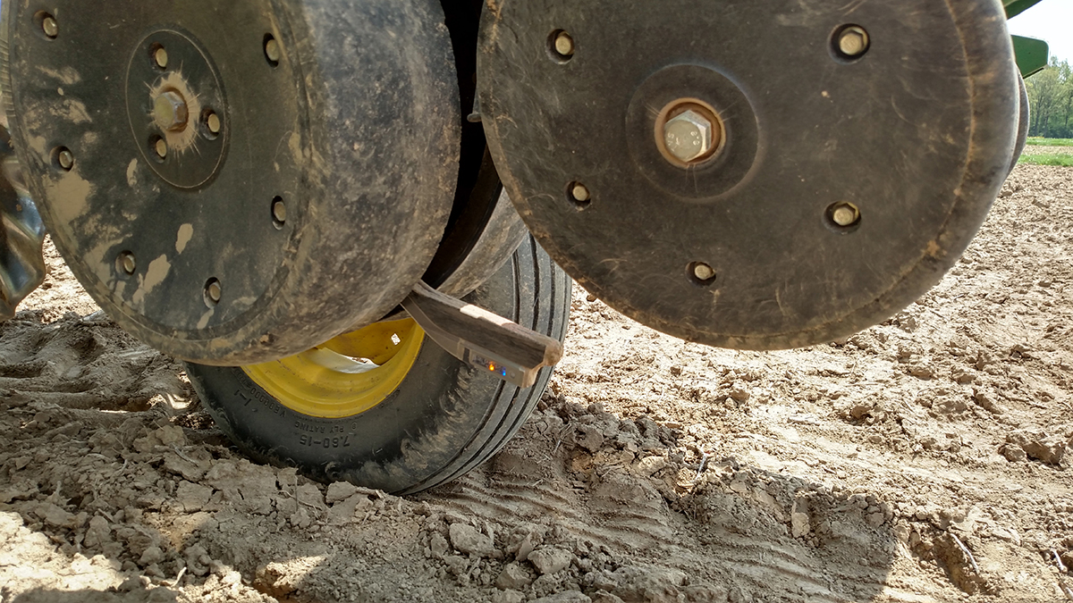 Sensor that allows for real-time measurement of soil temperature and organic matter within the planting furrow. Photo by Alexander Lindsey.