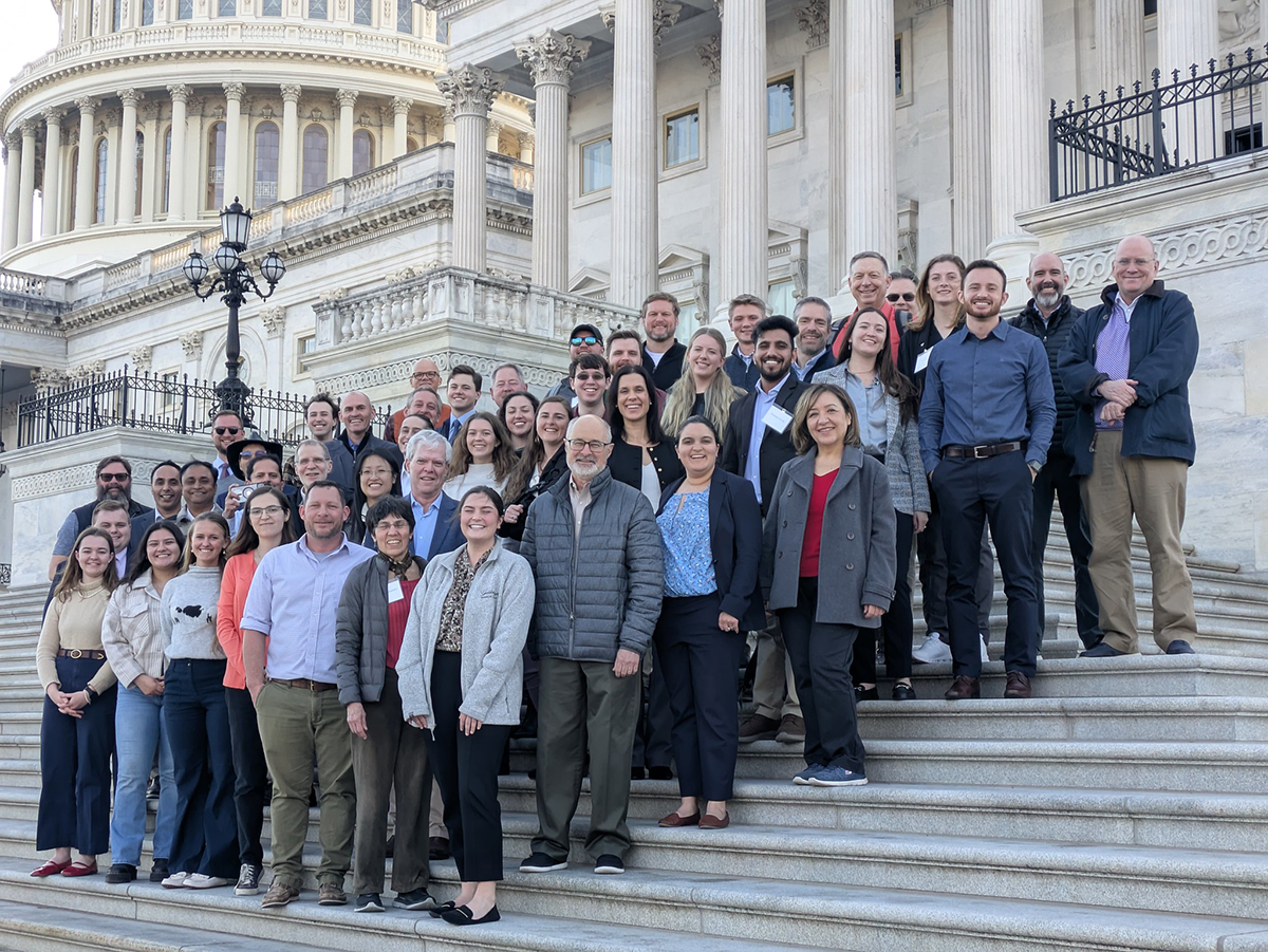 The Congressional Visits Day team poses in front of the U.S. Capitol.
