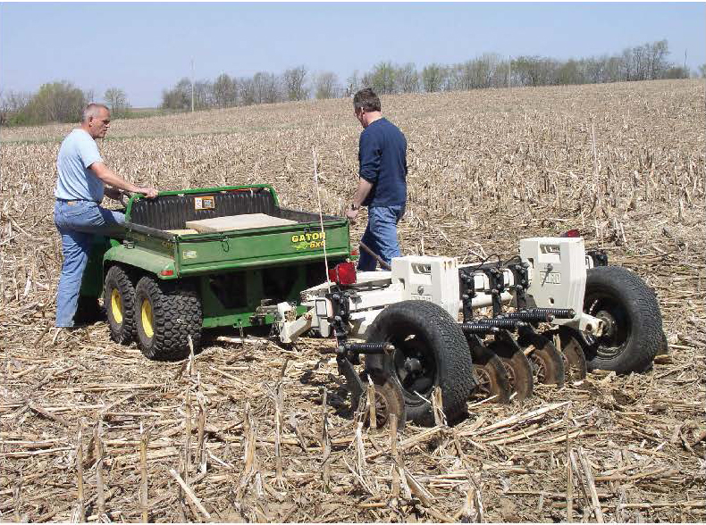 A soil apparent electrical conductivity (ECa) mapping system towed behind a utility vehicle in a field of corn stubble. Photo courtesy of the USDA-NRCS Soil Survey Manual.