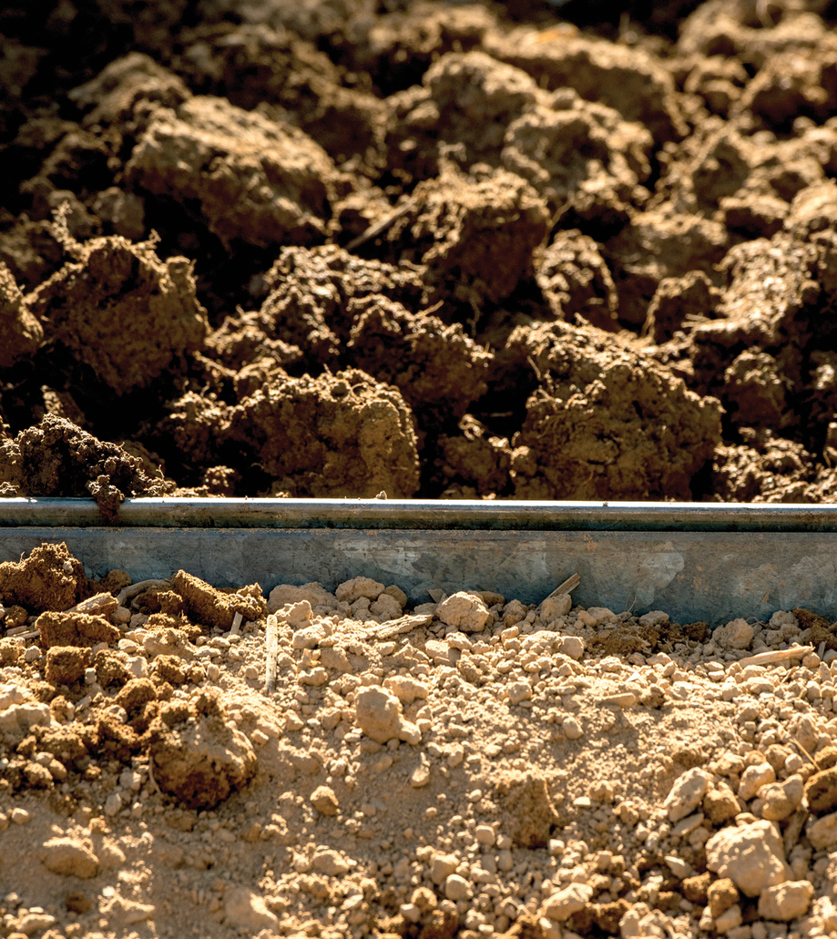 Under industrial agricultural practices, like the use of heavy machinery, soil structure is  compromised and microbial diversity weakened. This, in turn, affects agricultural produc- tivity. Here healthy moist soil (above) is contrasted with dry compacted soil (below). USDA  Photo by Lance Cheung.