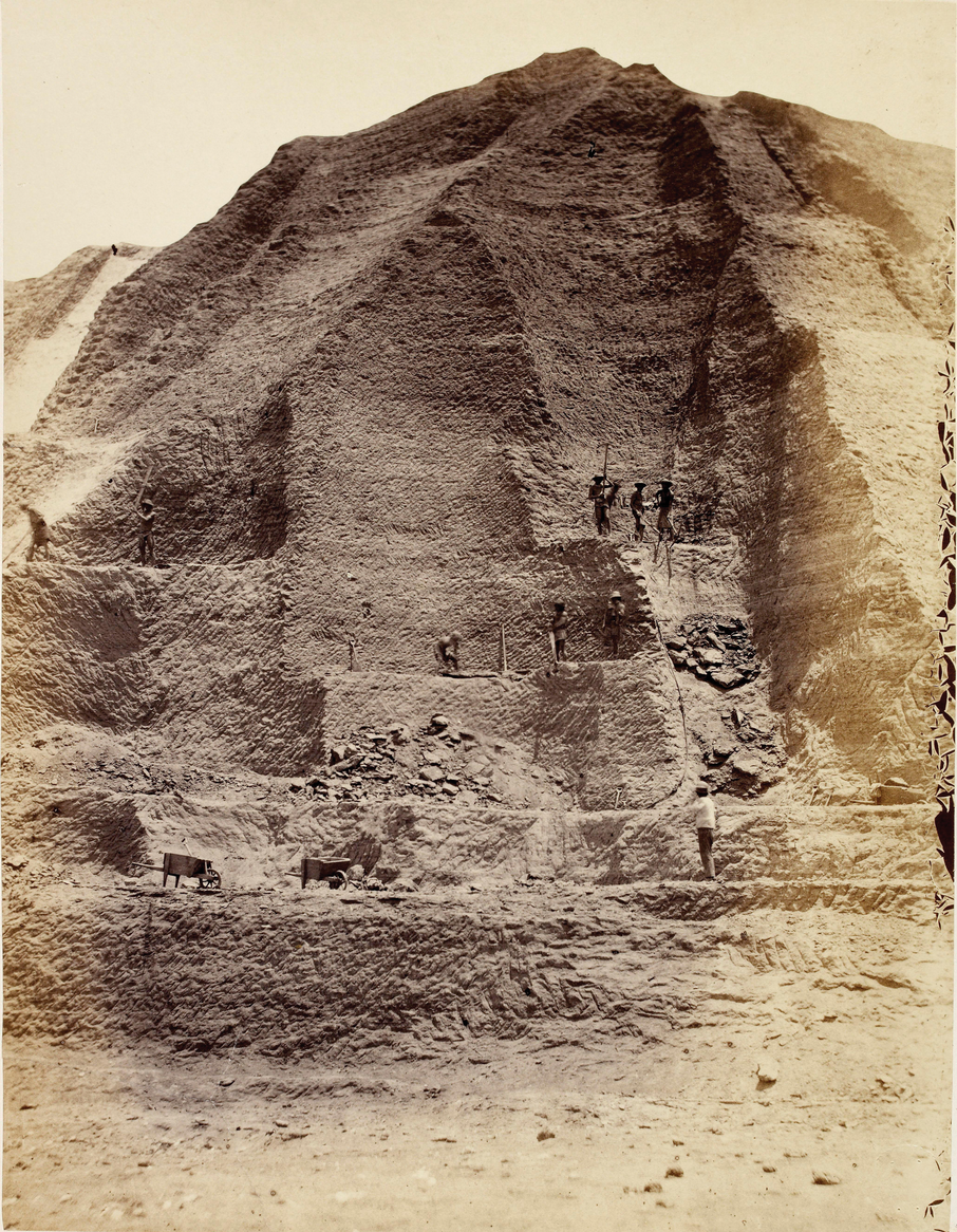 Figure 6. Workers in the 1860s excavate a “mountain” of guano more than 60 ft tall. Photo courtesy of Alamy Stock Photo/Album/British Library.