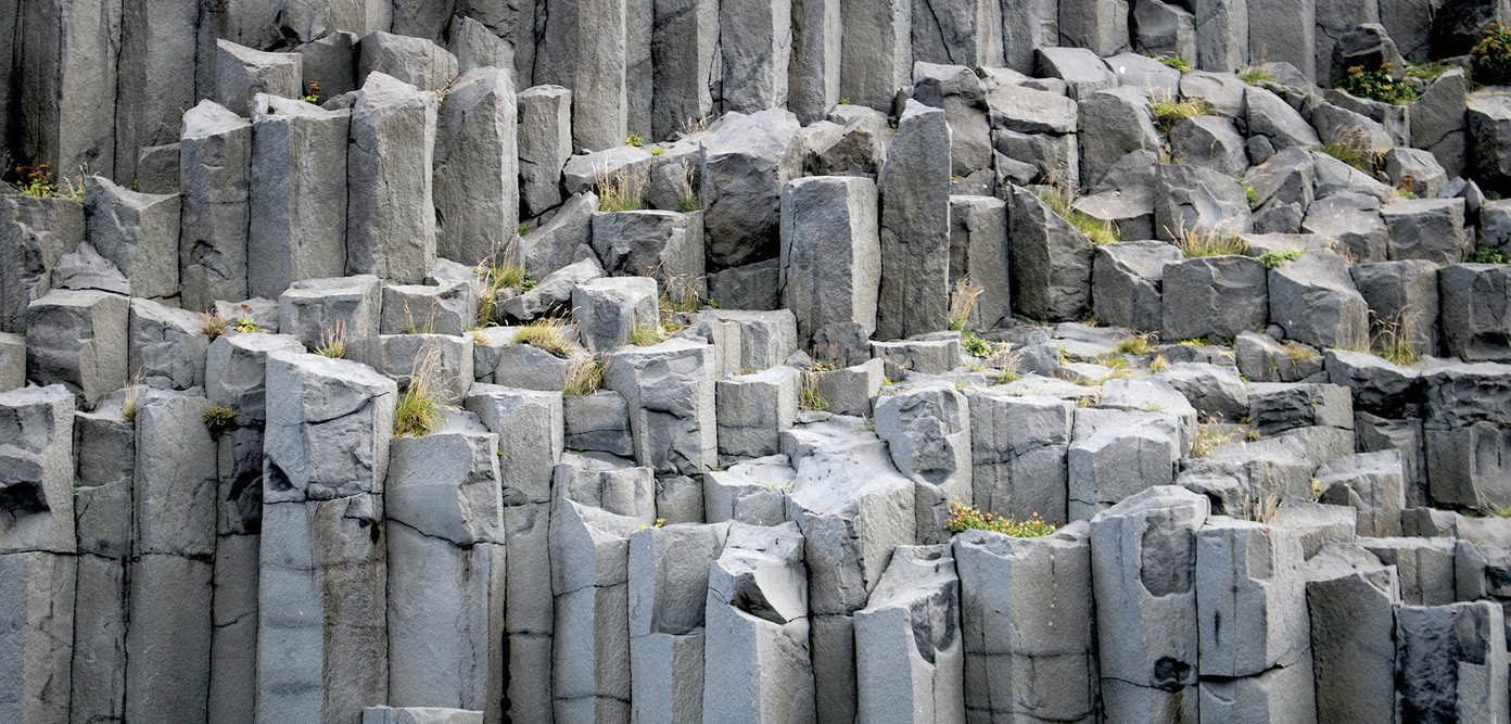 Basalt, an igneous volcanic rock that forms when molten lava cools, is well suited for enhanced rock weathering. The most abundant rock on earth, it is crushed and spread on agricultural fields to sequester carbon long-term. Photo by Jonathon Larson.