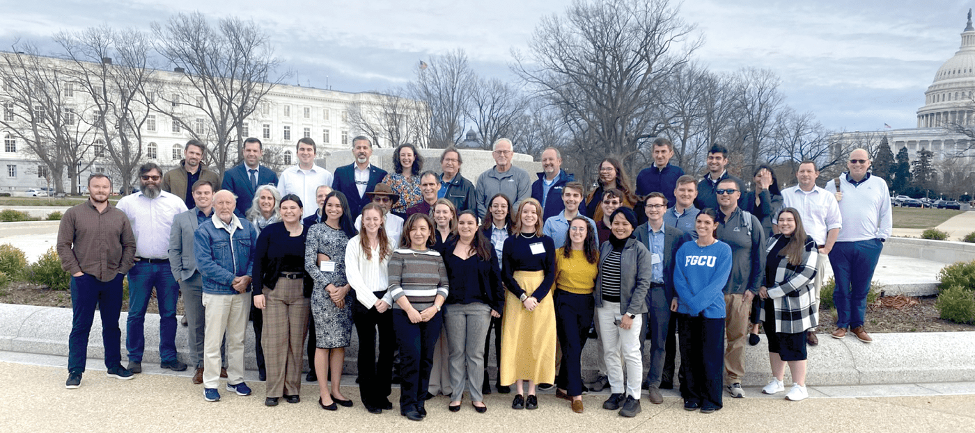 Congressional Visits Day attendees pose for a group photo near the U.S. Capitol. They represented 23 states and conducted 63 meetings with congressional offices.