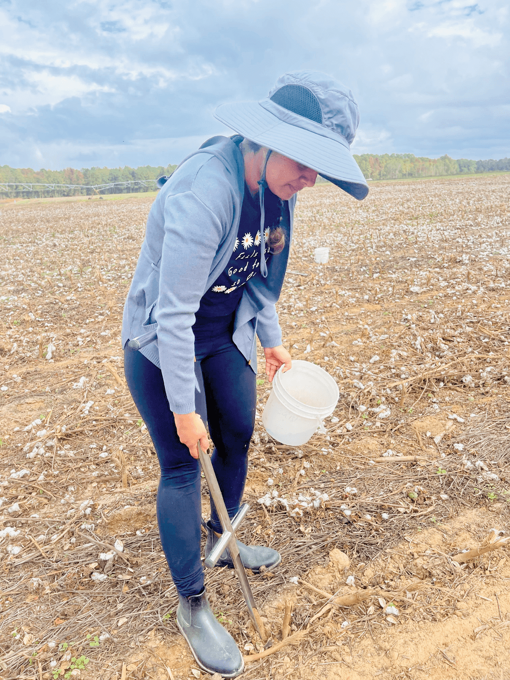 Clemson University Ph.D. student Pratima Poudel collects soil samples from the experimental plots. Photo by Binaya Parajuli.