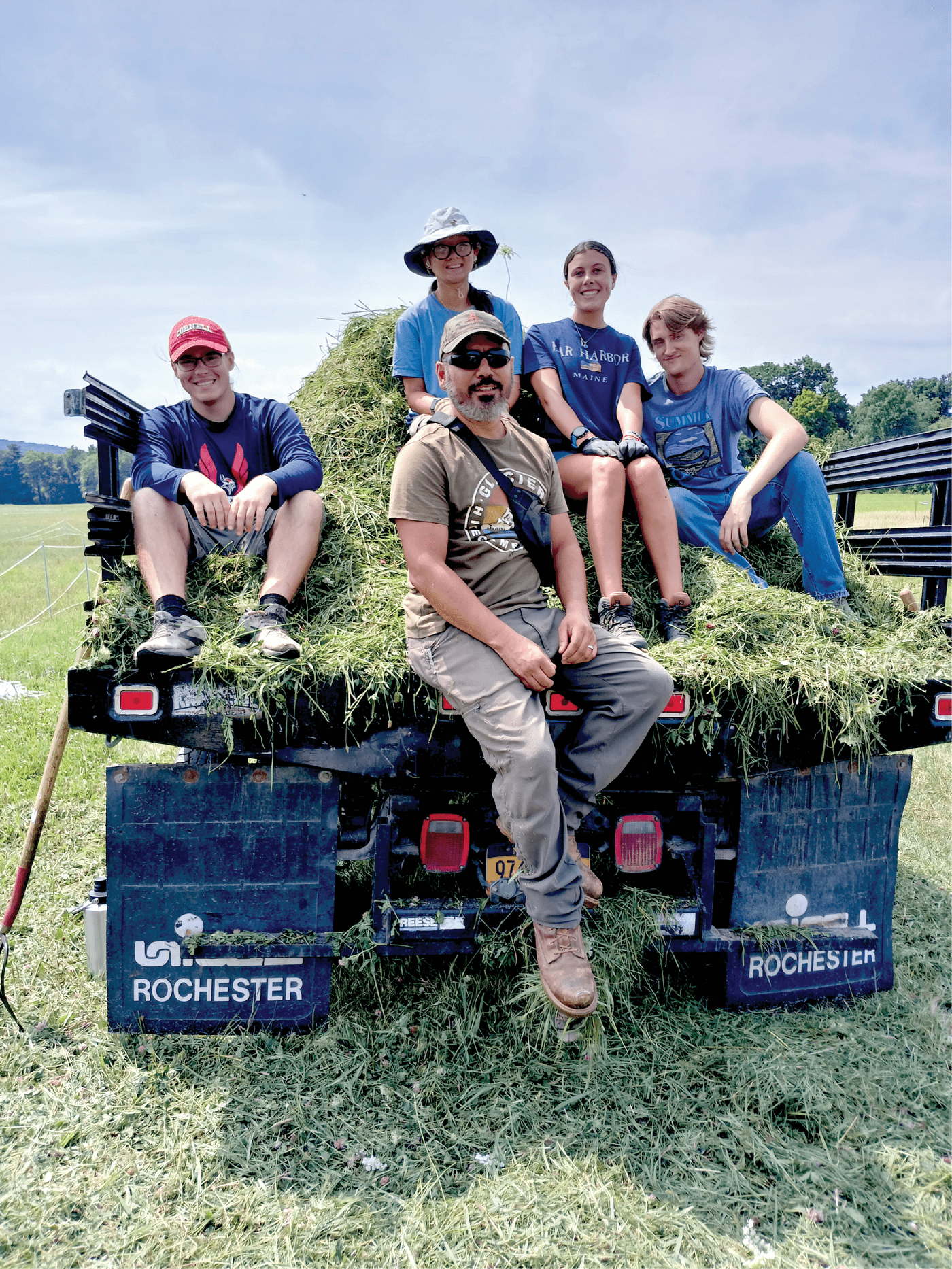 Interns participating in the Resilience Coordinated Agriculture Proj- ect (RCAP) in Dr. Virginia Moore’s lab at Cornell University in 2024 assist technician Jesse Chavez with alfalfa variety trial sampling.