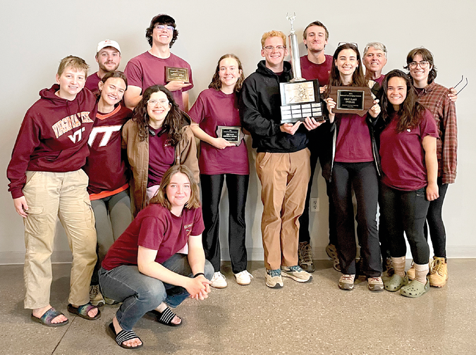 2024 National Collegiate Soils Contest champions: From left to right, left of trophy: Danielle Davies, Will Ubben, Grace Bartlett, Carmen Curry, Matt Smith (second place individual), (front) Delia Alcorn, and Liz Eroshenko (first-place individual). Joe Paterson is holding the trophy. From left to right, right of trophy: Sam Herrin, Rachel Parmele, Coach John Galbraith, Clara Betts, and Sinclair Anderson. Not pictured: Gracie Litsinger and Assistant Coach Clare Tallamy. Photo by John Galbraith.