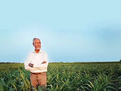 Gebisa Ejeta stands in a sorghum field. Source: Purdue University Agricultural Communications photo/Thomas Campbell.