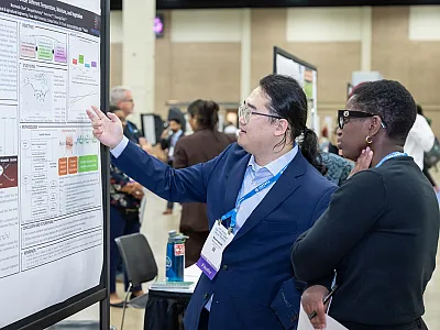 Contestant Beomseok Chun and Judge Christine Sprunger during the 2024 Diversity Student Poster Competition at CANVAS 2024 in San Antonio, TX.