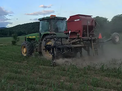 Seeder planting cover crops into standing corn. Photo by Jeff Sanders.