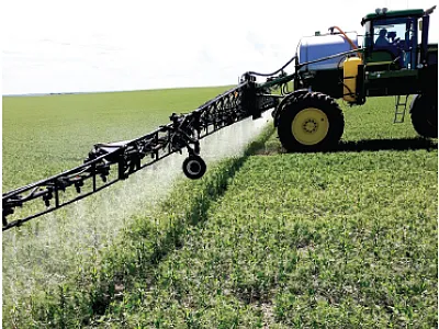 Figure 2. Spray application of a suspension of fine elemental S particles (Sulgro 70). Photo courtesy of Murray MacKinnon, Sultech.