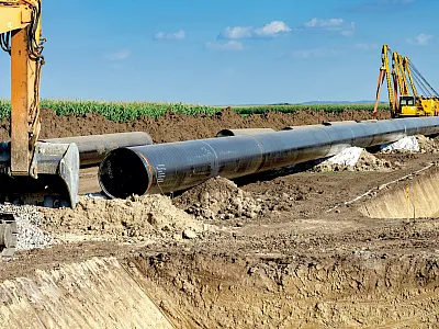 Pipeline Installation on a farm. Photo courtesy of Adobe Stock/RGtimeline.