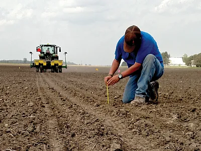 Checking seeding depth. Photo by Alexander Lindsey.