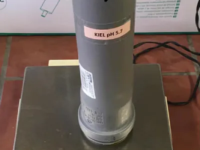 Weighing a soil column. Photo by Xinyue Cao.