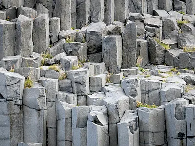 Basalt, an igneous volcanic rock that forms when molten lava cools, is well suited for enhanced rock weathering. The most abundant rock on earth, it is crushed and spread on agricultural fields to sequester carbon long-term. Photo by Jonathon Larson.