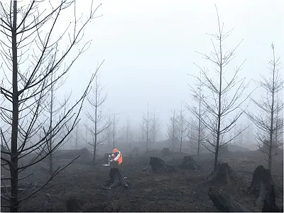 This site in the western Cascade Mountains in Oregon experienced a high-severity wildfire in September 2020. Here a researcher samples the soil in the winter of 2021 after the fire. Photo courtesy of K. McCool.