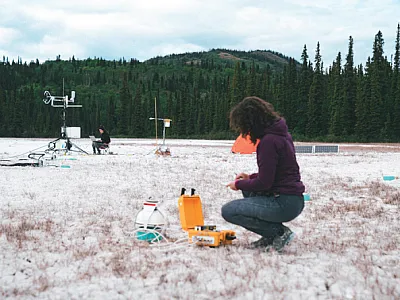 Researchers measure CO2  fluxes and other data at the hydromag- nesite-magnesite playa near Atlin, BC. Photo courtesy of Andrew  Mattock
