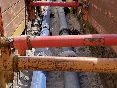 Construction of a trench with two drinking-water supply pipes made of cast iron and polyethylene, respectively. Photo courtesy of Claus Haslauer, VEGAS, University of Stuttgart, Germany.