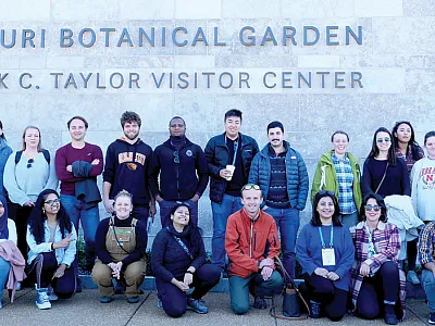 Students pose for a picture in front of the Missouri Botanical Gardens. Photo by Jyoti Prasad Kakati.