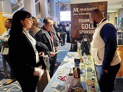 Undergraduate student member Cy’Heim McRae promotes the value of ASA, CSSA, and SSSA to attendees of the Minorities in Agriculture, Natural Resources, and Related Sciences (MANRRS) Career Fair. Photo by Sara Uttech.