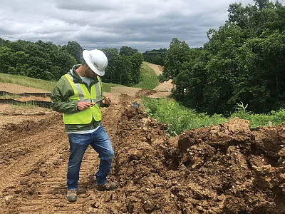 James Hartsig taking a soil sample.