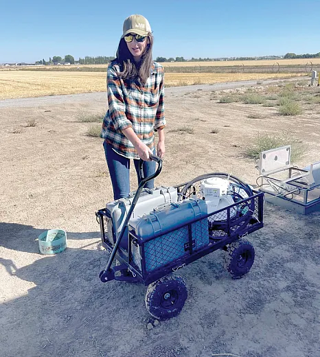 Abigail Baxter with a LIâCOR unit that measures greenhouse gas emissions at the USDAâARS Northwest Irrigation and Soils Research site in Kimberly, ID.