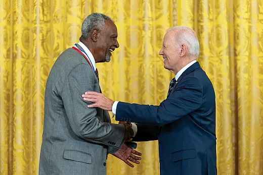 U.S. President Joe Biden, right, congratulates Gebisa Ejeta after awarding him the National Medal of Science on October 24. Source: White House Photo/Alamy Stock Photo.