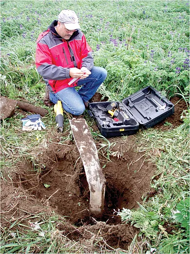 A groundwater monitoring well being decommissioned by NOAA personnel. Photo courtesy of Greg Gervais, NOAA Pribilof Project Office.