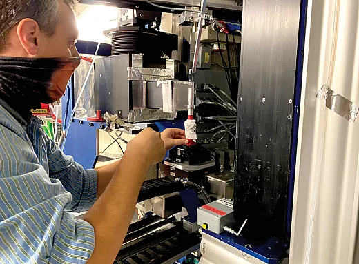 Andreas Cramer, a Ph.D. student at ETH Zurich, prepares a sample of sand and microplastics to be imaged with neutrons at Switzerlandâs Paul Scherrer Institute. The research team was the first to image how microplastics affect water in soils. Photo courtesy of Andreas Cramer.