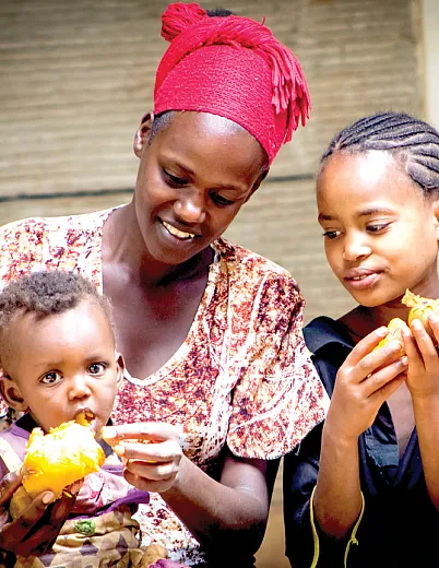 Demonstrating different ways of cooking and baking with orange-fleshed sweet potato (OFSP) at community events helps people realize they can do it at home. Photo by Frezer Asfaw.