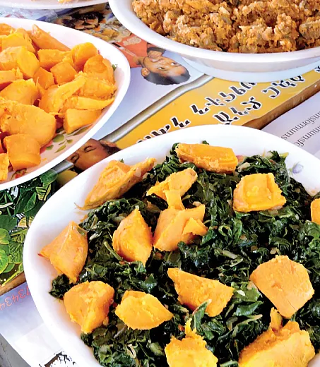 Orange-fleshed sweet potato (OFSP) advocates work to get the word out that OFSP leaves are also very nutritious and can be easily incorporated into regular cooking. Photo by Jan Low.